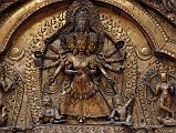 Kathmandu Bhaktapur 04-3 Bhaktapur Durbar Square Golden Gate Torana Taleju Bhawani Close Up Here is a close up of the four-headed and 10-armed figure of the goddess Taleju Bhawani directly above the door of the Golden Gate in Bhaktapur�s Durbar Square. On the left Shri stand on a crocodile; on the right Lakshmi stands on a tortoise.
